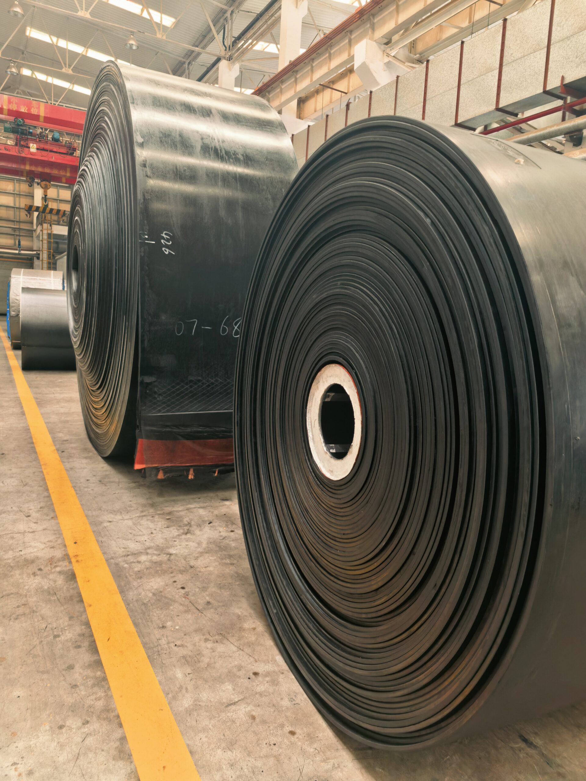 Conveyor system at an industrial material handling site